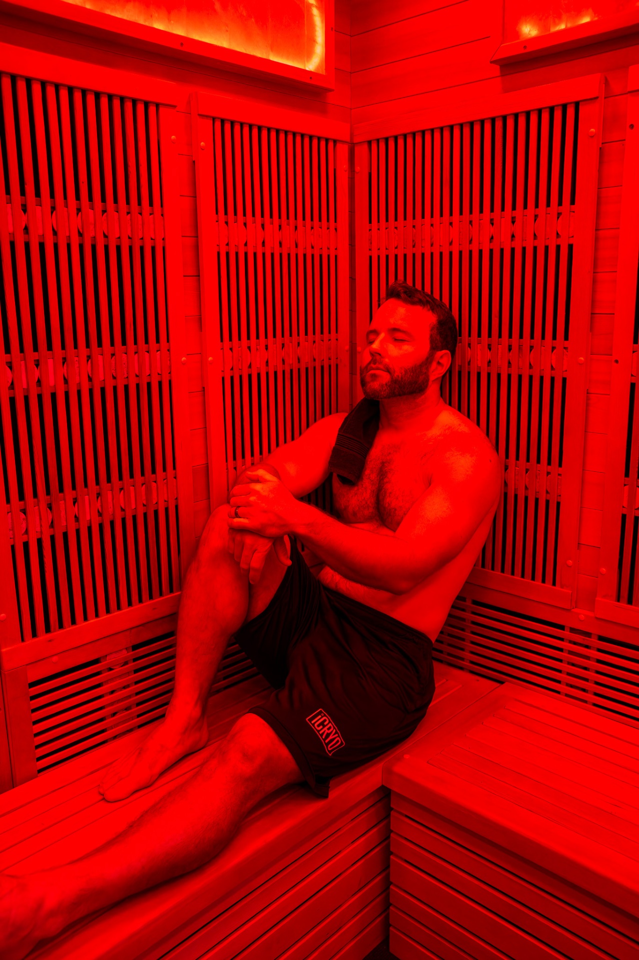 Guest relaxing inside a full-spectrum infrared sauna at iCRYO South Jordan