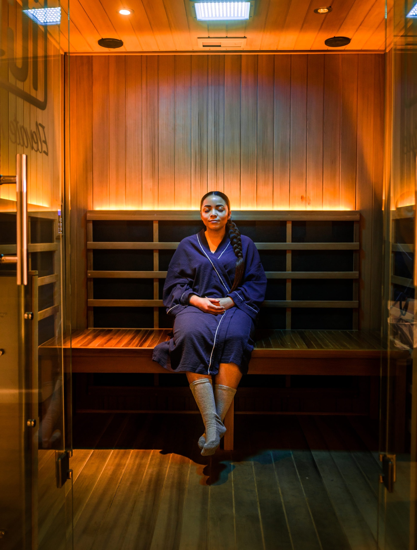 iCRYO South Jordan guest relaxing in a private infrared sauna suite