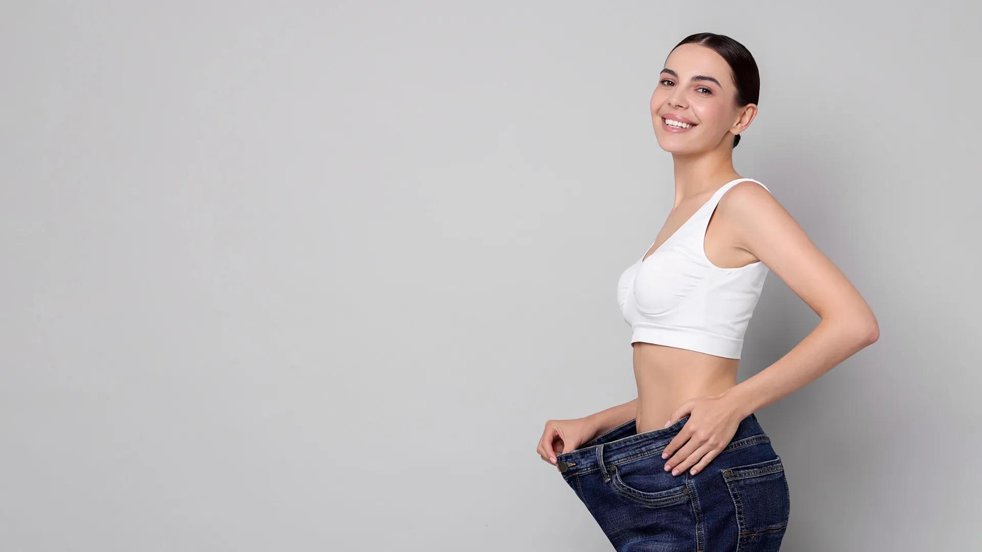 Woman celebrating weight loss results at iCRYO South Jordan Medical Weight Loss program