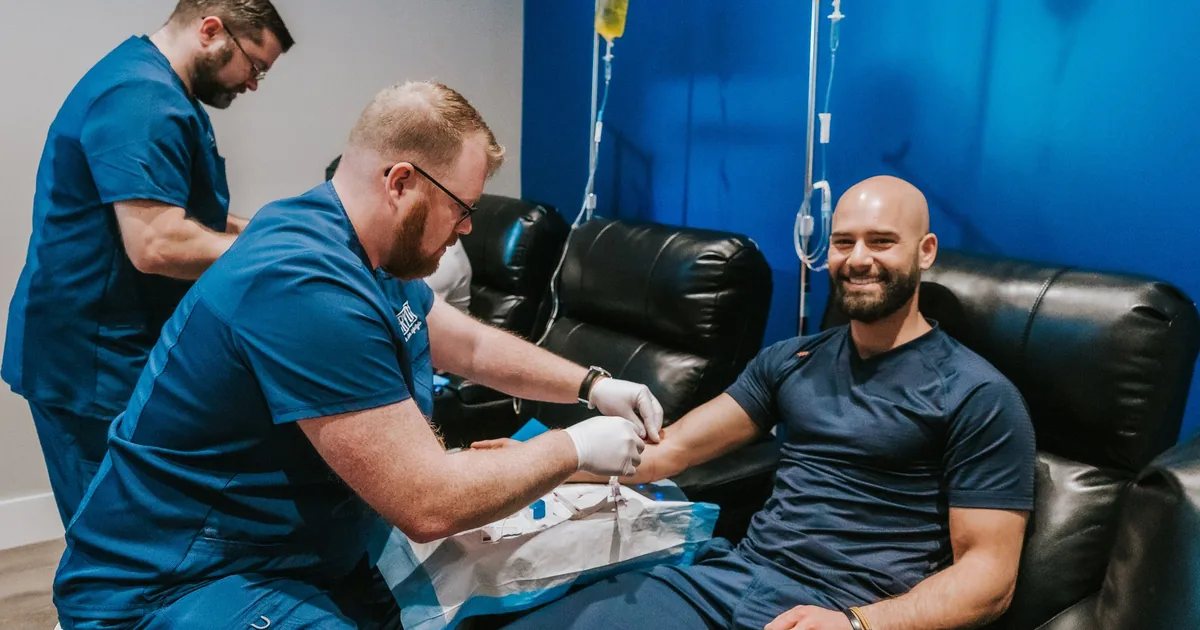Client relaxing during an IV vitamin drip at iCRYO South Jordan, UT
