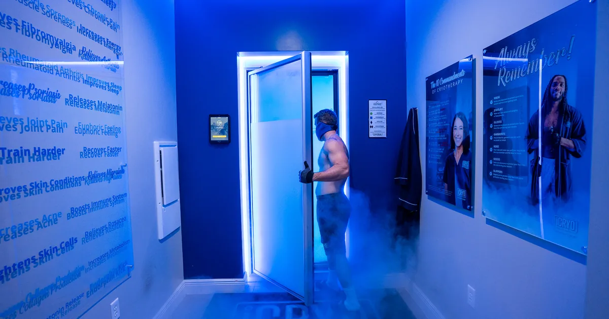 Client in a whole-body cryotherapy chamber with cold vapor at iCRYO South Jordan, UT